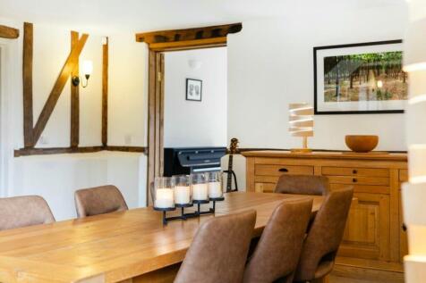 Stylish dining room with warm timber tones