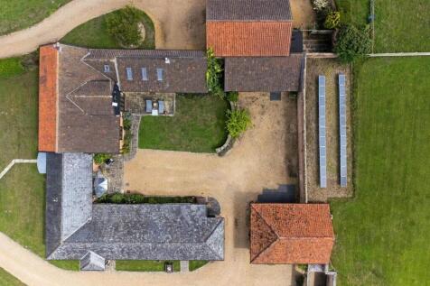 A birds eye view of Mill House Barn with the secur