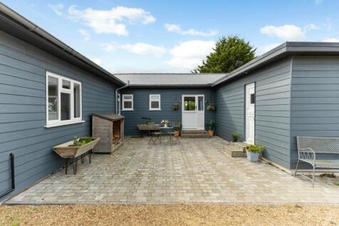 Charming courtyard entrance with seating area