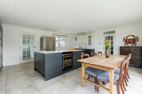 Elegant kitchen with central island and dining