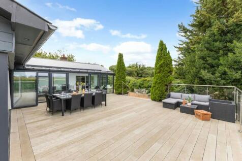 Expansive terrace with dining and lounge areas