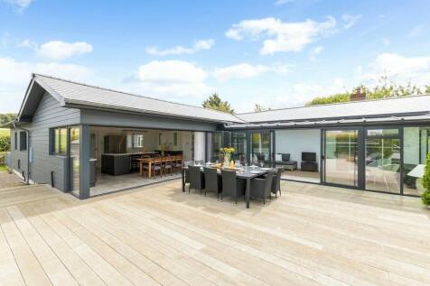 Kitchen, sun room and terrace dining stylishly con
