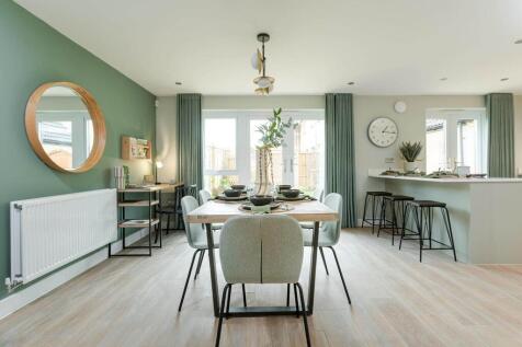 Double doors lead from the dining area to the garden, perfect for al fresco dining