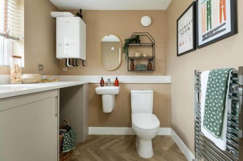 A utility area offers space for laundry appliances