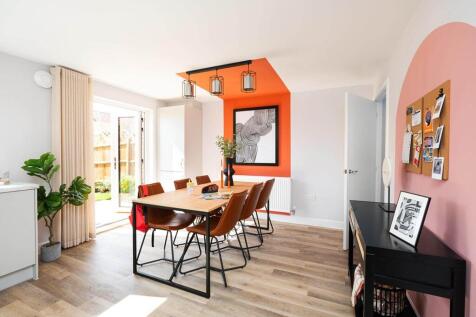Double doors lead from the dining area to the garden, making alfresco dining easy