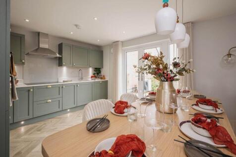 Double doors lead from the kitchen dining area to the garden, perfect for alfresco dining