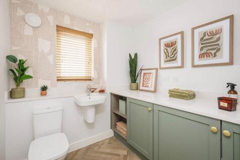 A guest cloakroom completes the ground floor