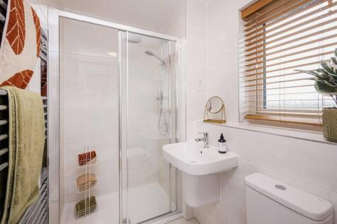 Bedroom 1 also hosts a private en suite shower room