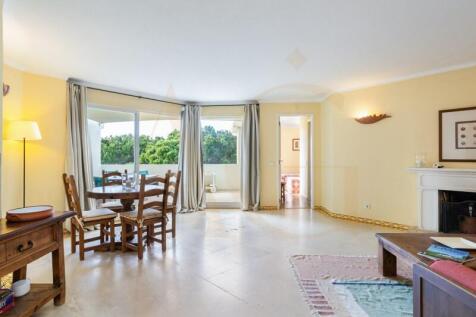 Spacious living room with windows to terrace