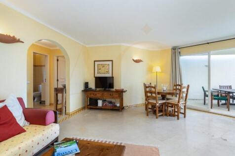 Spacious living room with fireplace and terrace