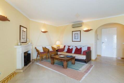Spacious living room with fireplace and terrace