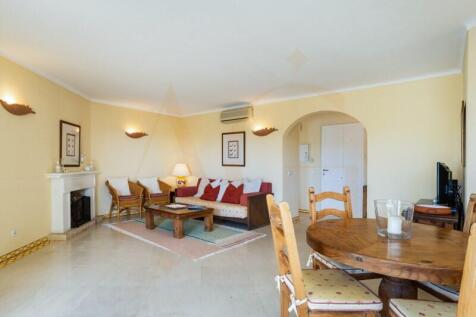 Spacious living room with fireplace and terrace