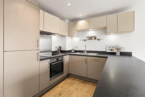 Experience the harmony of style and utility in this modern kitchen space.