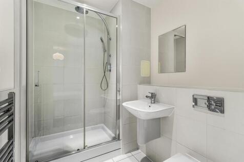 Experience luxury in this sleek and modern bathroom with high-end finishes.
