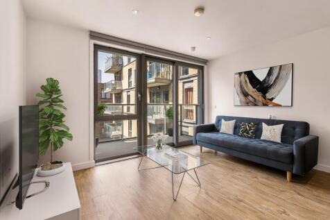 Experience contemporary comfort in this stylish urban living room, complete with elegant decor and inviting views.