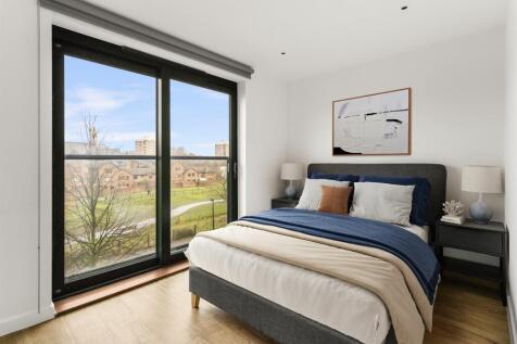 Experience tranquility in this elegantly designed bedroom with splendid outdoor views.