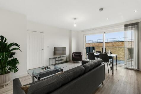 Experience modern living with a stylish lounge area and terrace access.