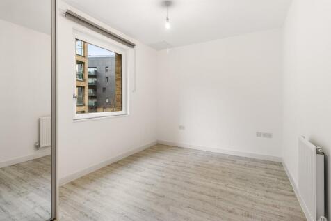 Imagine your perfect haven in this bright, modern room with ample natural light.