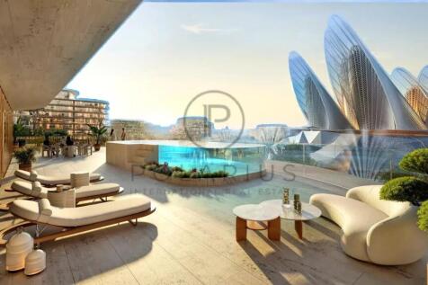 A luxurious balcony features modern lounge chairs 