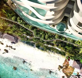 Aerial view of a coastal area featuring a curvy mo