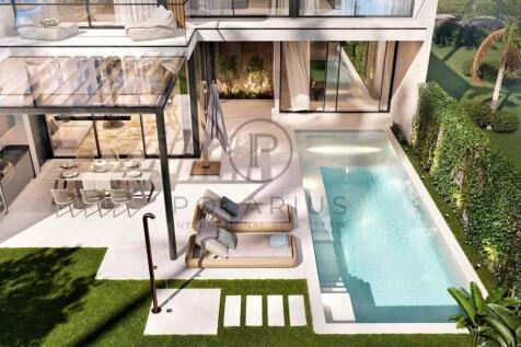 Modern home with a sleek pool, outdoor dining area
