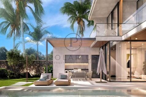 Modern luxury home with large windows, a pool, sun