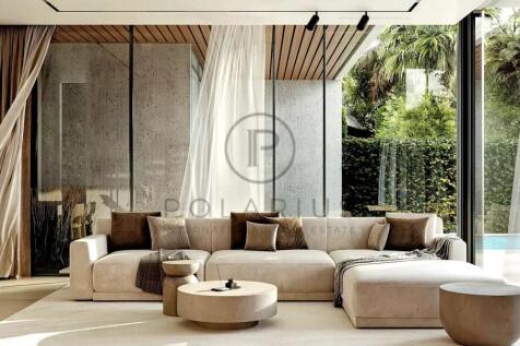 A modern living room with a beige sectional sofa, 