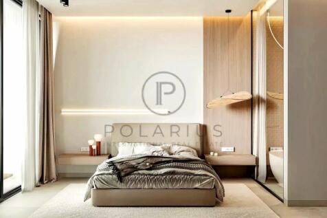 A modern, minimalist bedroom with a neutral color 