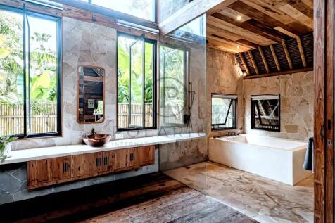 Luxurious bathroom with wooden elements, large win