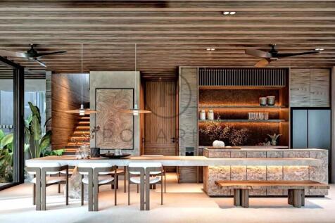 A modern, stylish kitchen and dining area with woo