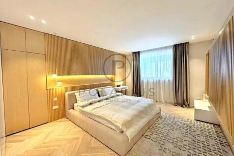 Modern bedroom with a neutral color palette featur