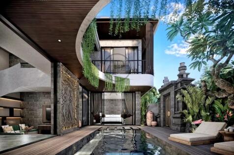 Modern villa with an outdoor pool, surrounded by g