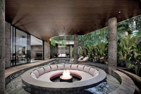 A modern, open-air seating area featuring a sunken