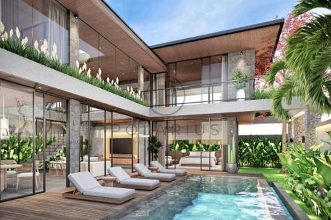 Modern villa with a pool, surrounded by greenery a