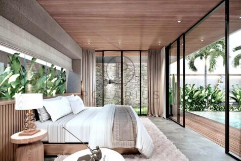 Modern bedroom with large windows, wood accents, a