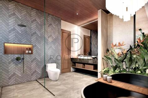 A modern bathroom features a glass-enclosed shower