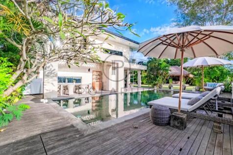 Luxurious villa with a pool, surrounded by greener