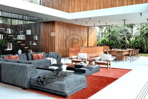 This is a modern, open-concept living and dining a