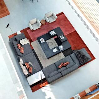 A modern living room with a sectional sofa, colorf