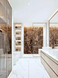 A modern bathroom featuring a marble-tiled shower,