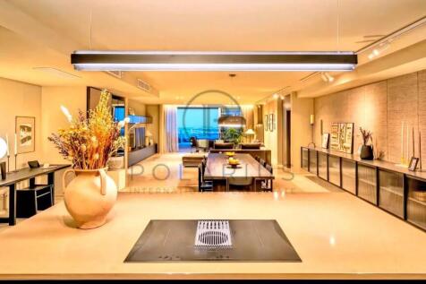 A modern, well-lit living space featuring a sleek 