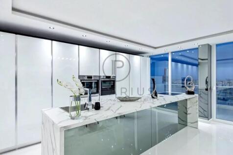Sleek modern kitchen with a marble island, glossy 