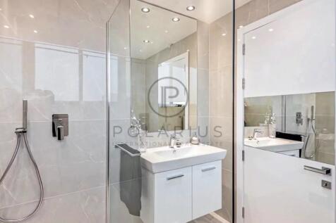 Modern bathroom with a glass shower enclosure, sle