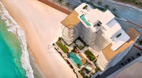 The image shows an aerial view of a beachfront lux