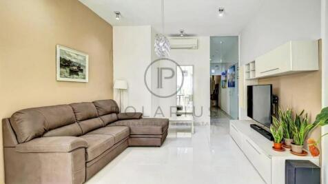 Contemporary living room with a brown sectional so