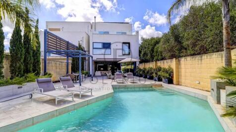 Modern villa with a swimming pool, lounge chairs, 