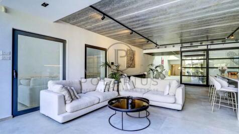 Modern living room with a spacious white sectional