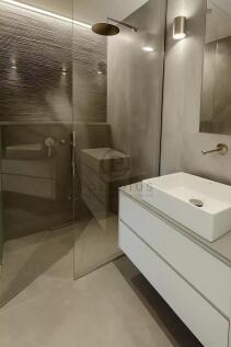 A modern bathroom featuring a minimalist design wi