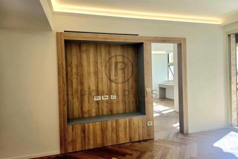 Modern minimalist room with a wooden accent wall,