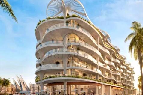 A modern, multi-story building with curved archite